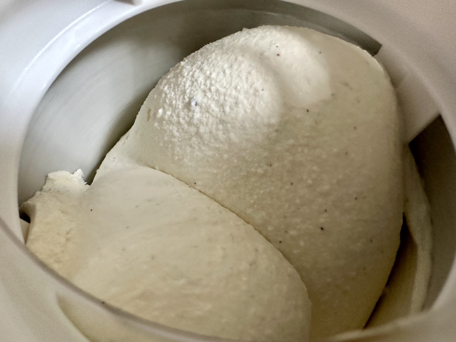 Vanilla ice cream in the churning tub.